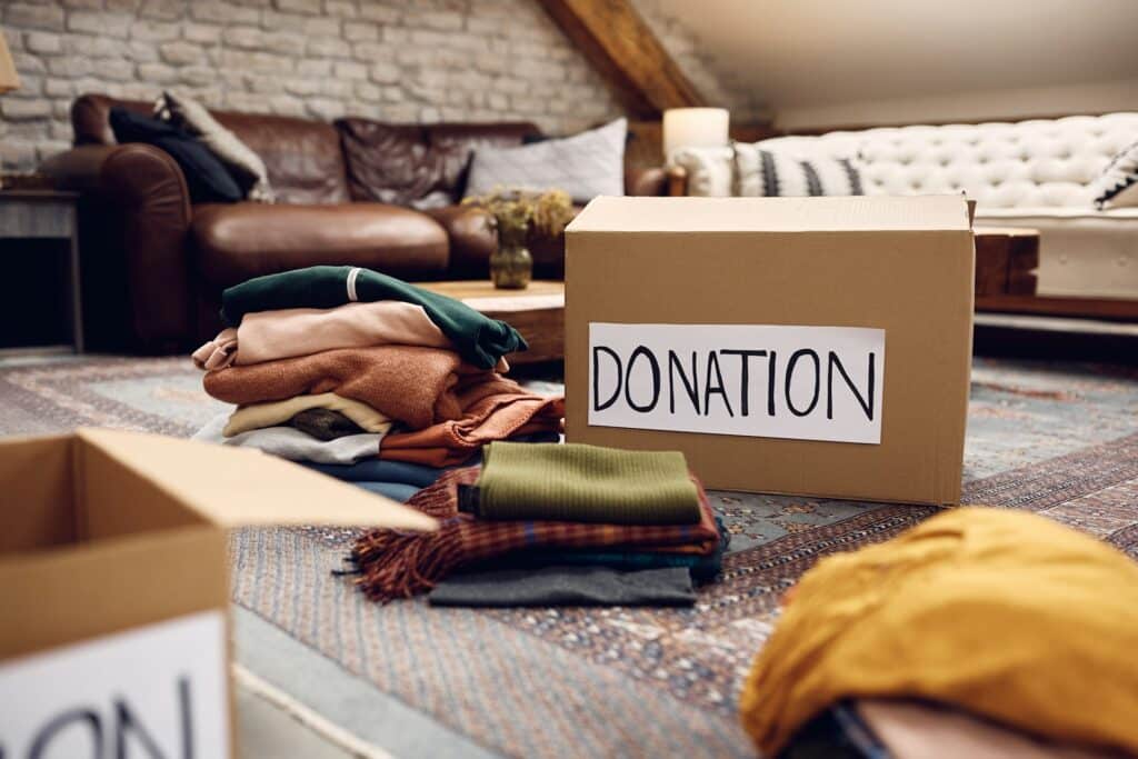 donation box with clothes around